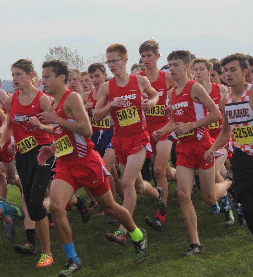 Isaiah Schaetzle (11), Evan Wille (12), Drew Weber (9) Connor Kilgore (10), and Foster Hull (10) fight through the pack during an October meet