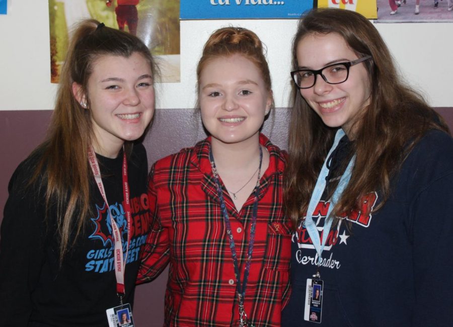 Bailey Hammerand (12), Maddi Lyons (12), and Meredith Kass (12) show off their PJs during Snowcoming week. The group could just as easily have been heading to a sleepover!