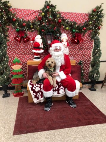 The reporters dog, Asher, poses for a picture with Santa